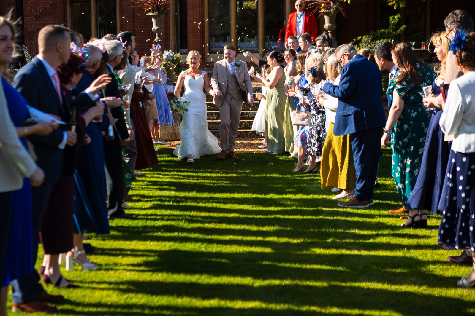 Confetti moment at Holmewood Hall wedding in Cambridgeshire