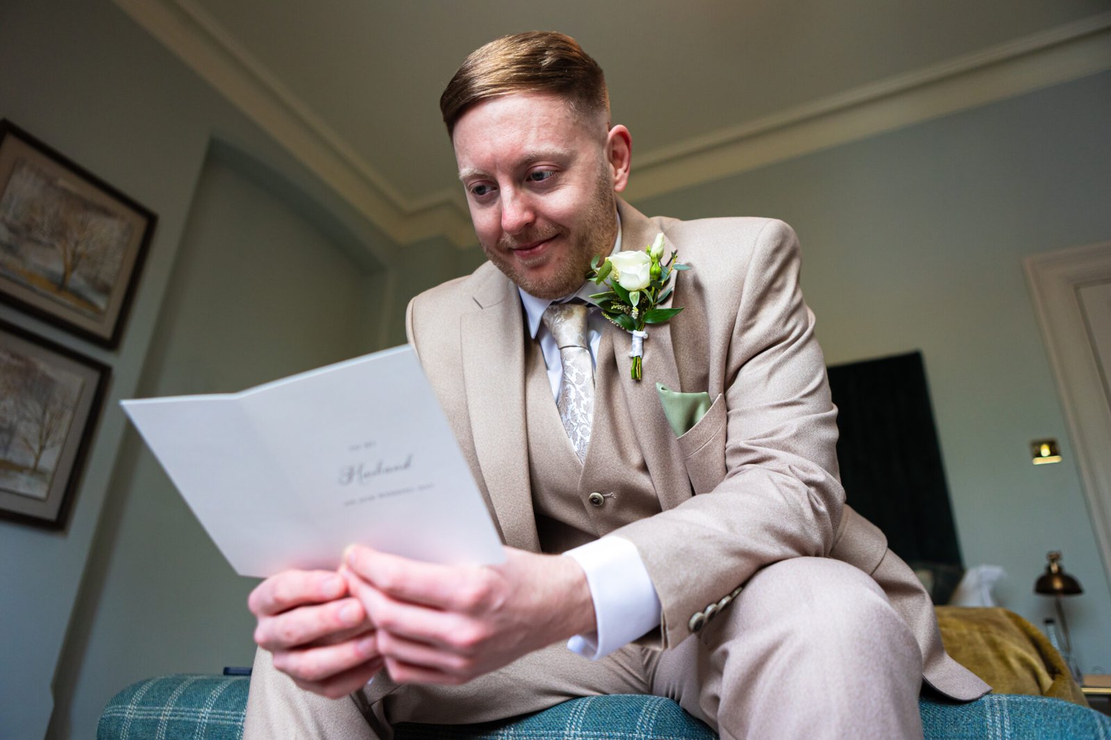 Groom preparations at Holmewood Hall captured by Cambridge wedding photographer