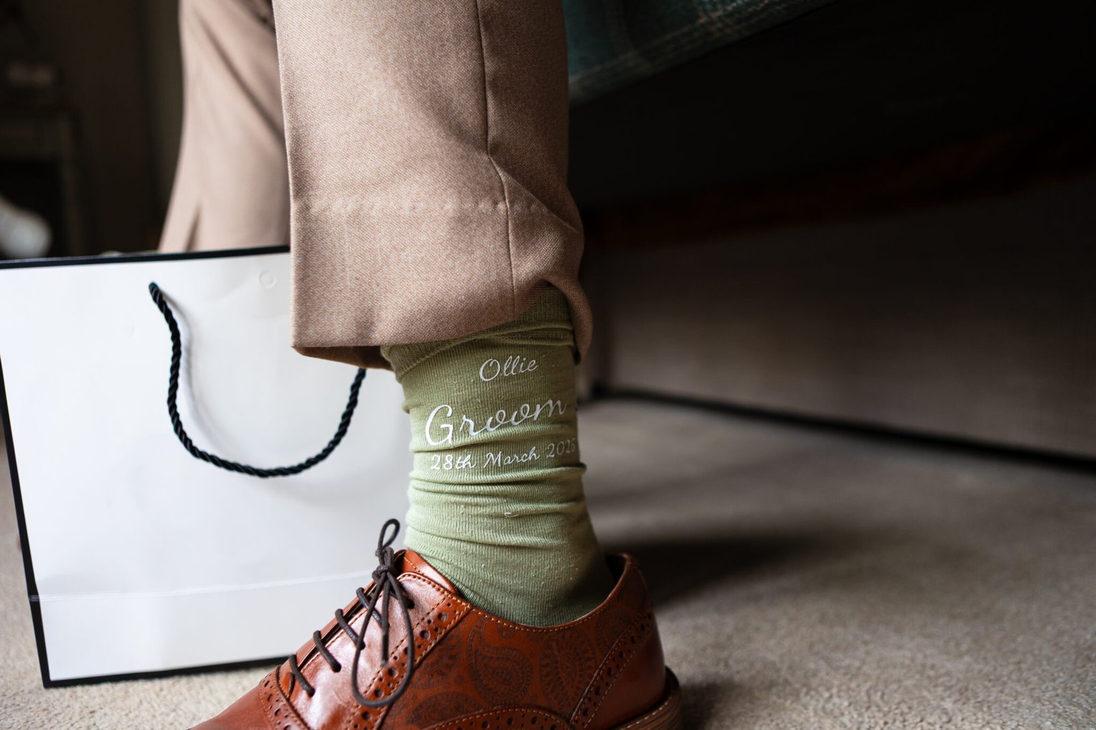 Groom preparations at Holmewood Hall captured by Cambridge wedding photographer