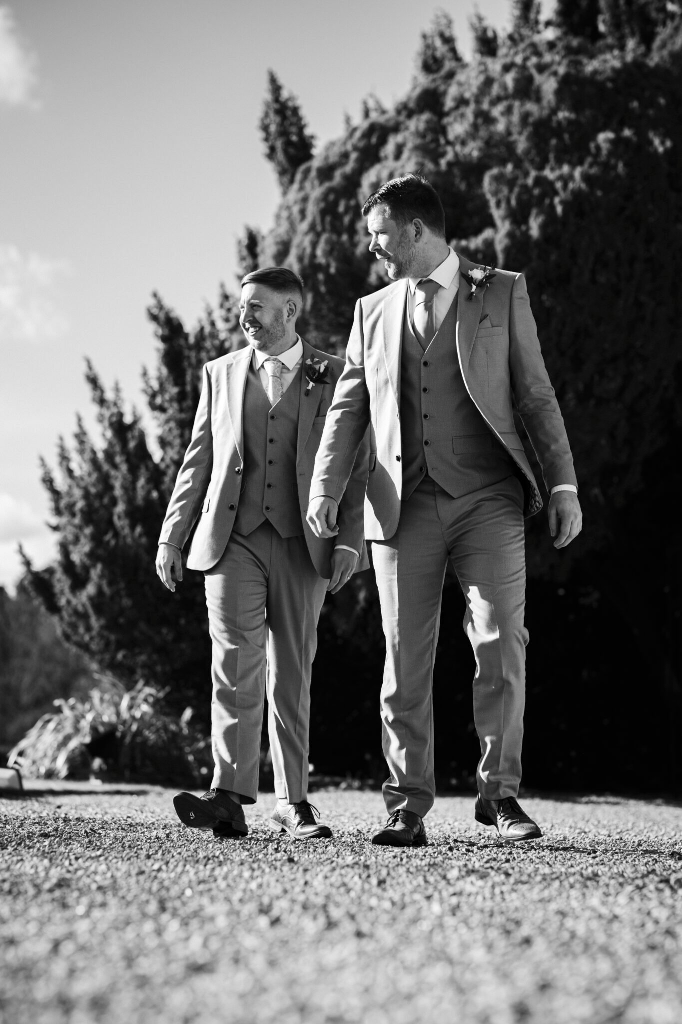 Guests celebrating outside Holmewood Hall wedding venue Natural wedding photography at Holmewood Hall