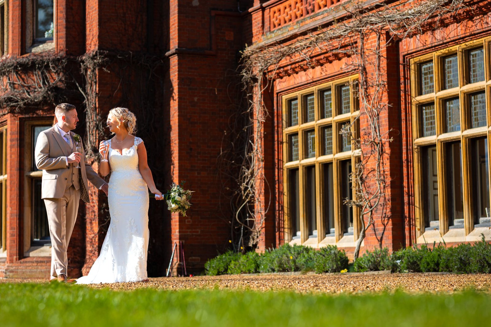 Bride and groom portraits in the gardens at Holmewood Hall