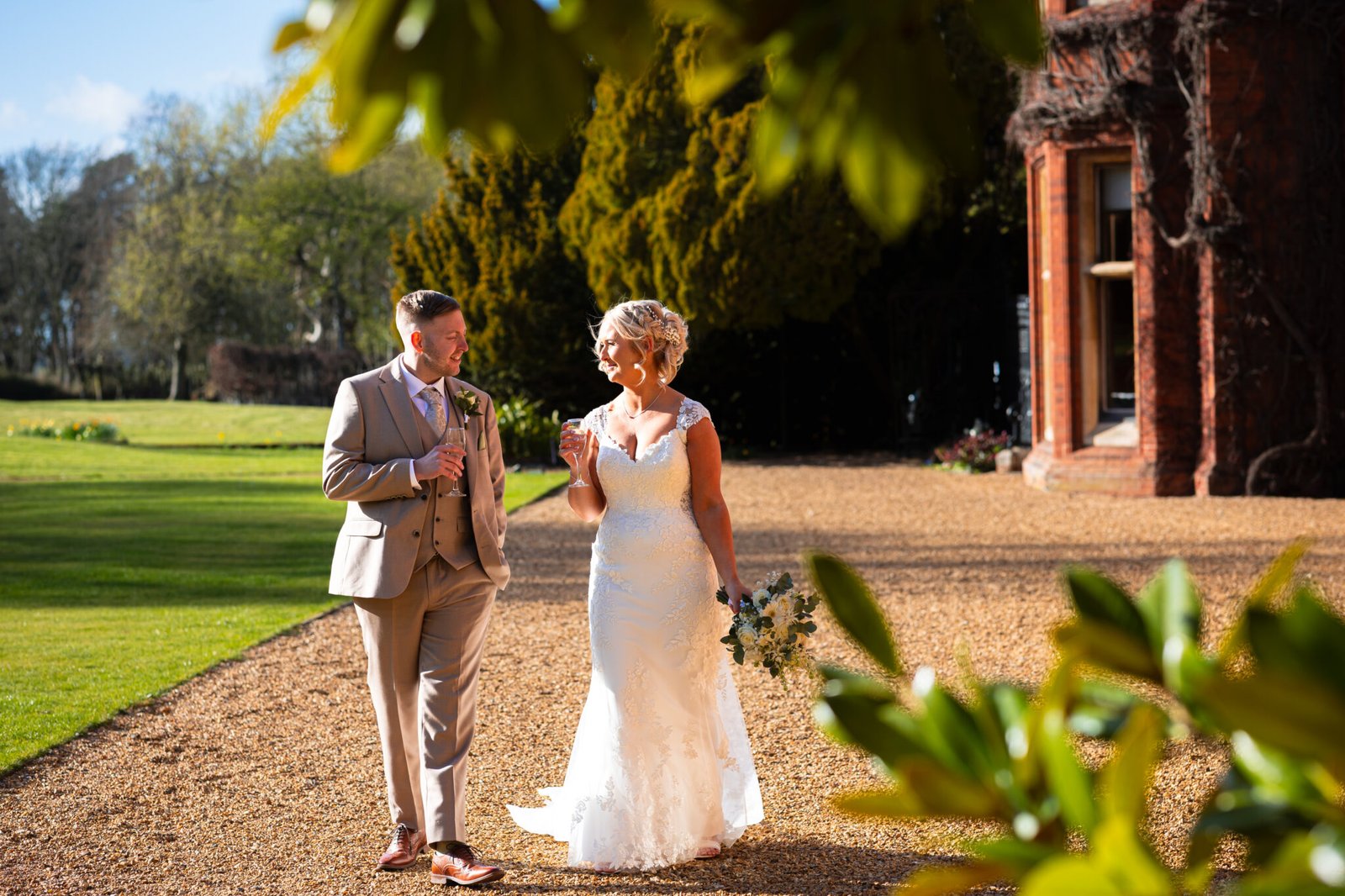 Bride and groom portraits in the gardens at Holmewood Hall