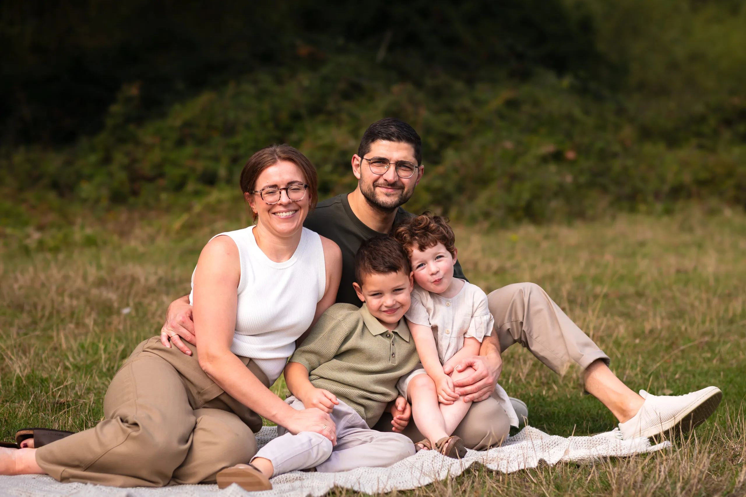 family portrait sitting together at the millpond cambridge